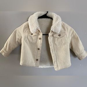 Kith toddler jacket size 12-18M. Beige color with fur on inside. Moderately worn